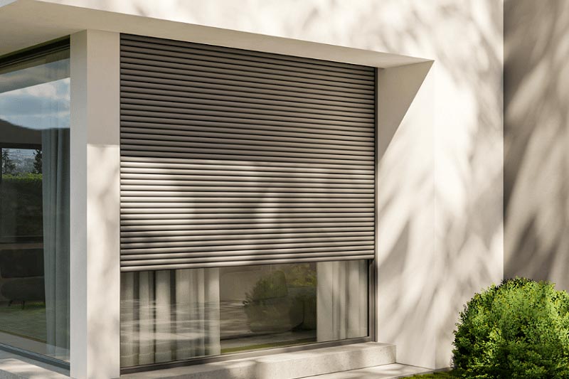 Electric roller shutters on modern home